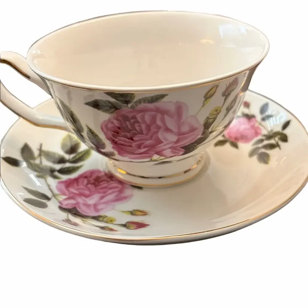 Three modern coordinating cup and saucer sets in shades of pink.